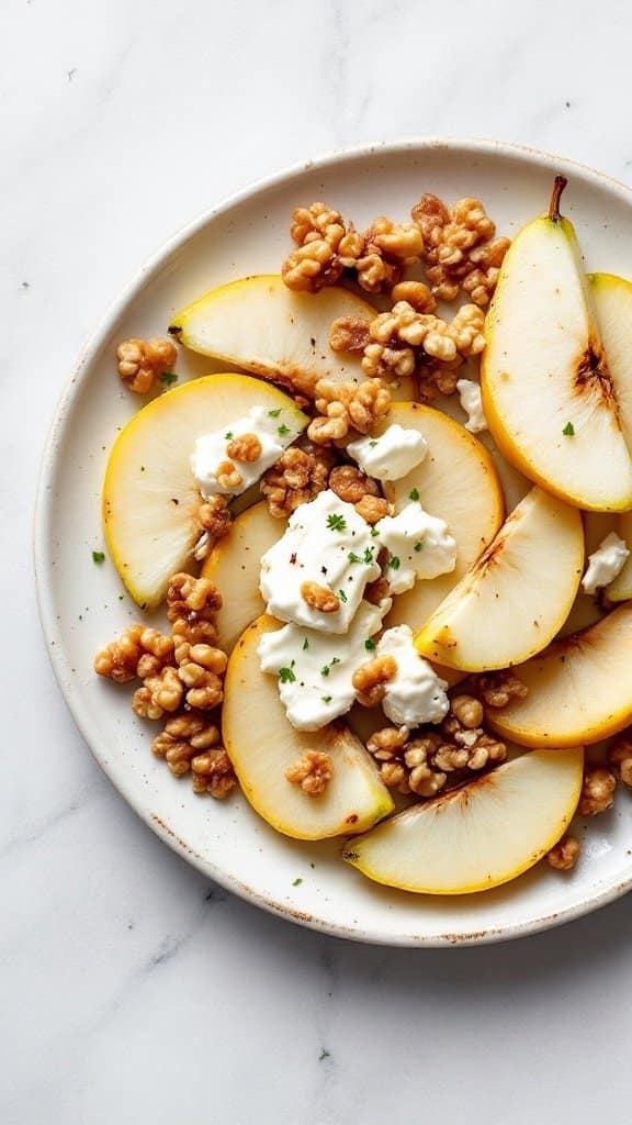 Plate of sliced pears topped with goat cheese and walnuts.